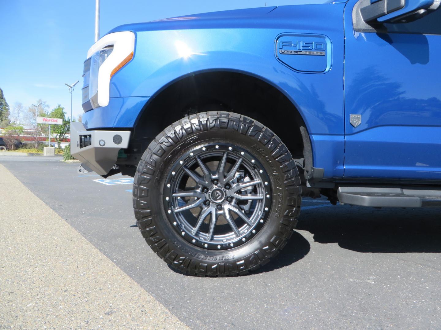 2022 BLUE /BLACK Ford F-150 Lariat Crew Cab 4WD (1FT6W1EV6NW) , located at 2630 Grass Valley Highway, Auburn, CA, 95603, (530) 508-5100, 38.937893, -121.095482 - Tired of gas prices and still want to look cool? Check out this Ford Lightning featuring a RC level kit, Nitto Ridge Grappler tires, Fuel Rebel wheels, Sinister front and rear bumpers, Baja Designs leds, Rigid Industries Leds, Bakflip F1, and window tint. - Photo#8